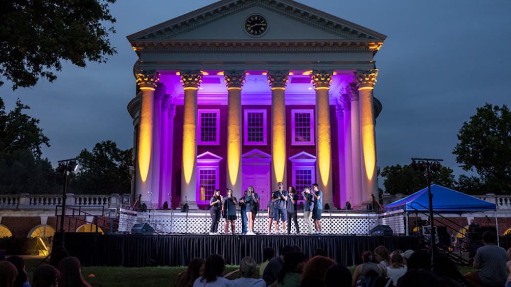As night fell, hundreds of students filled the Lawn with picnic blankets and snacks to listen to performances at this year’s Rotunda Sing.