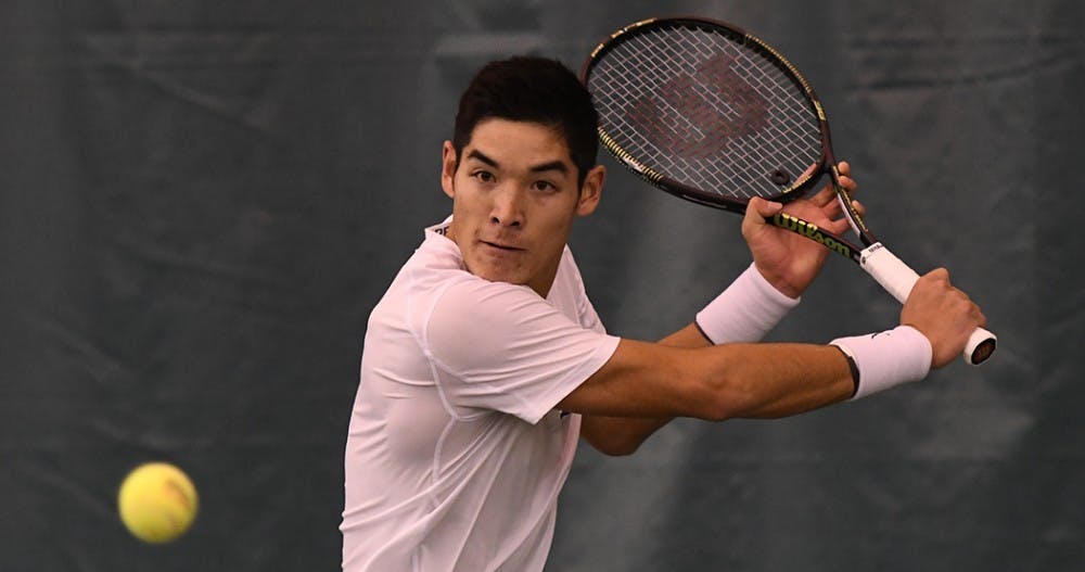 <p>Senior Thai-Son Kwiatkowski won his doubles and singles match Sunday against Duke.&nbsp;</p>