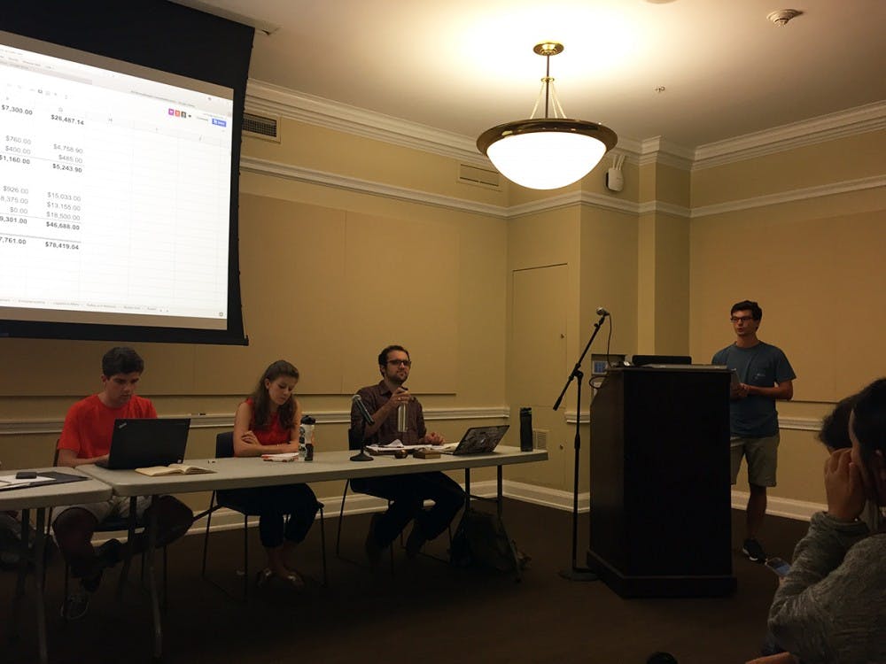 <p>Michael Horth, a third-year Commerce student and Student Council's chief financial officer, introduces the budget at the podium.</p>