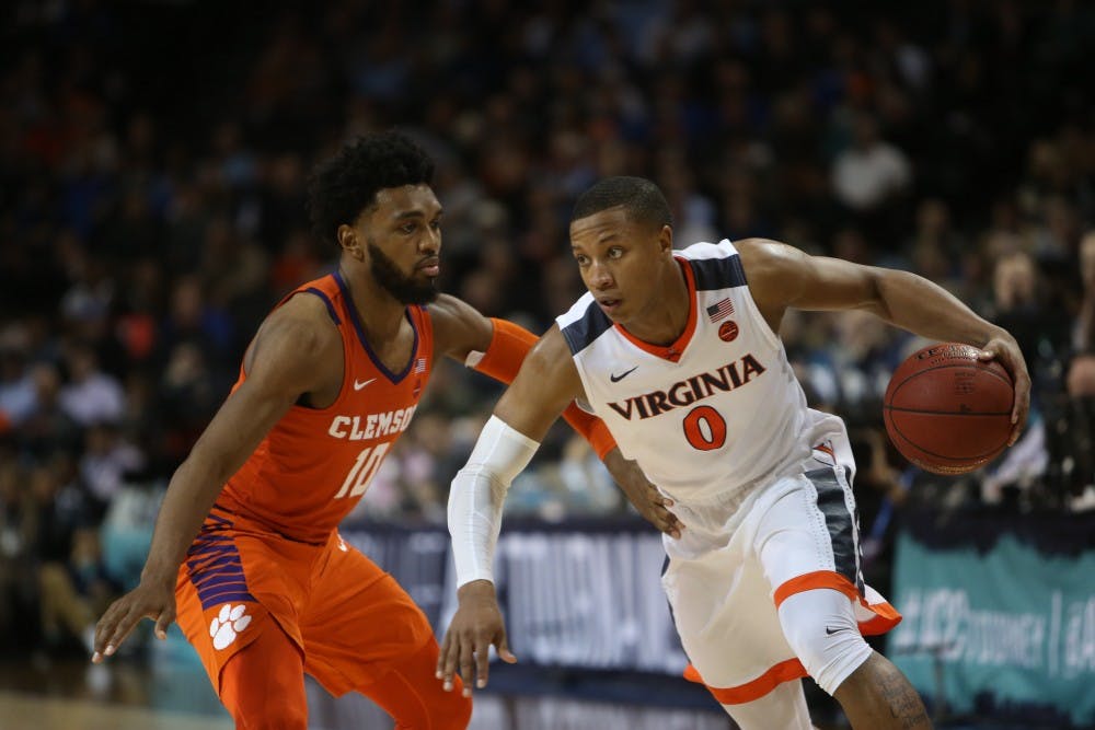 Senior guard Devon Hall's steady play helped Virginia past Clemson.