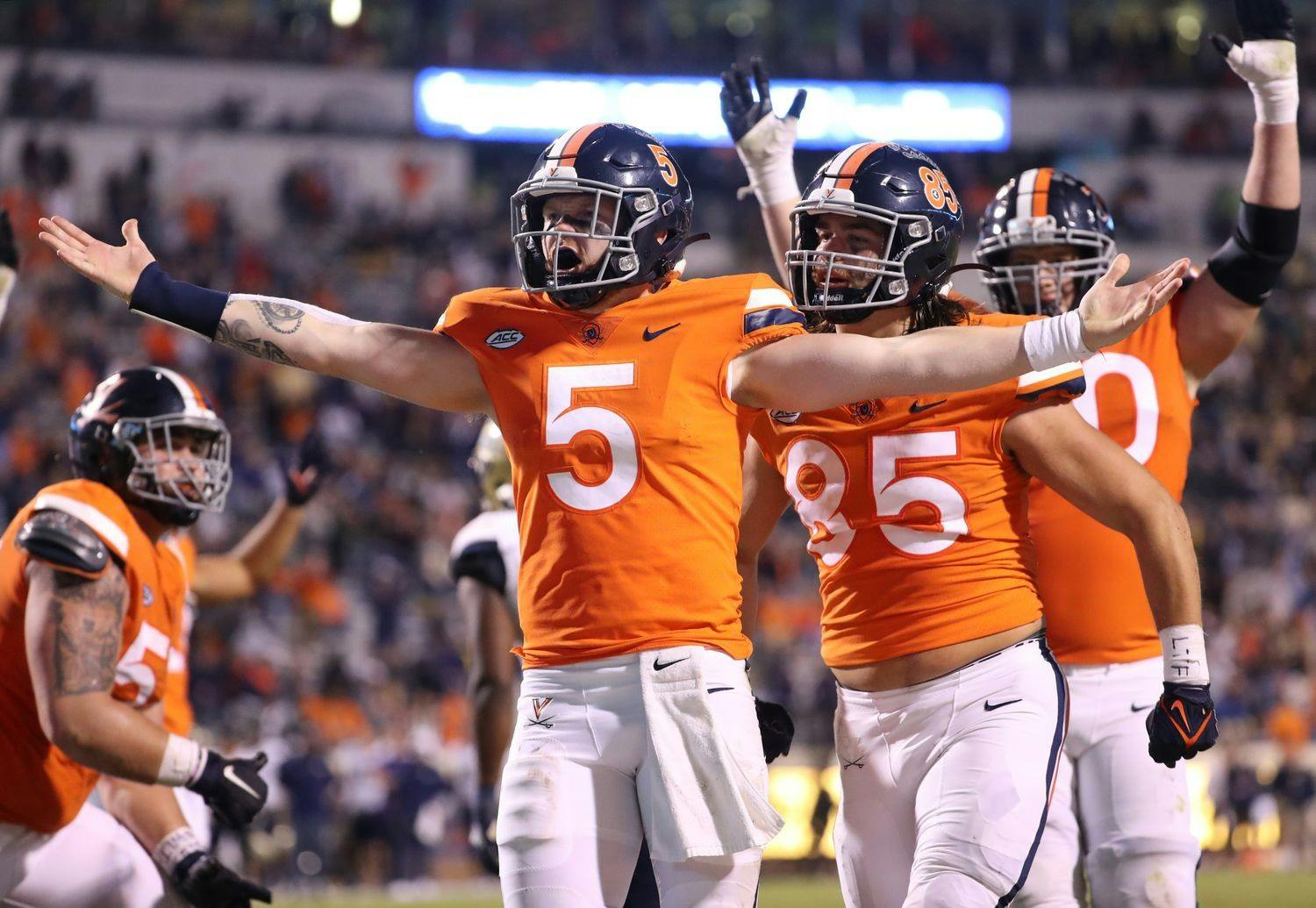 Virginia junior quarterback Brennan Armstrong celebrates after rushing for a touchdown in the third quarter against Georgia Tech Saturday night.