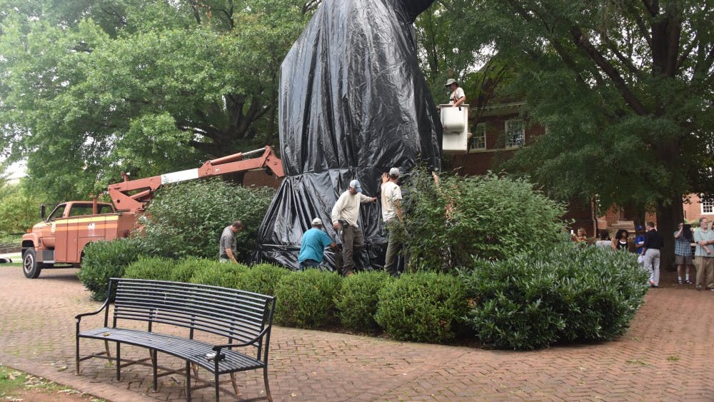 Crews covering the Thomas "Stonewall" Jackson statue in Justice Park.&nbsp;
