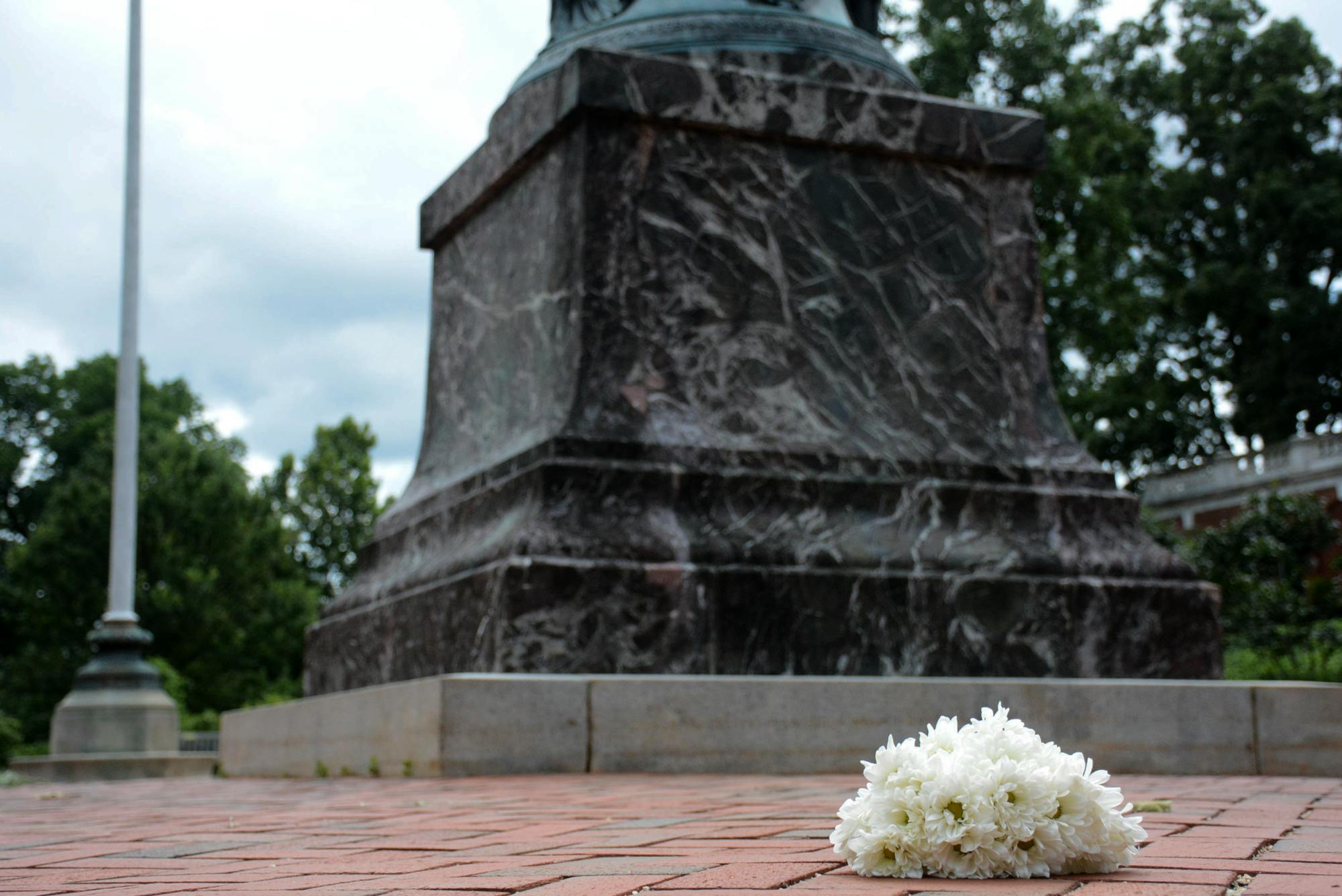 Flowers at the base of the Jefferson Statue, where students counter-protestors met a group of white supremacists Aug. 11, 2017.&nbsp;