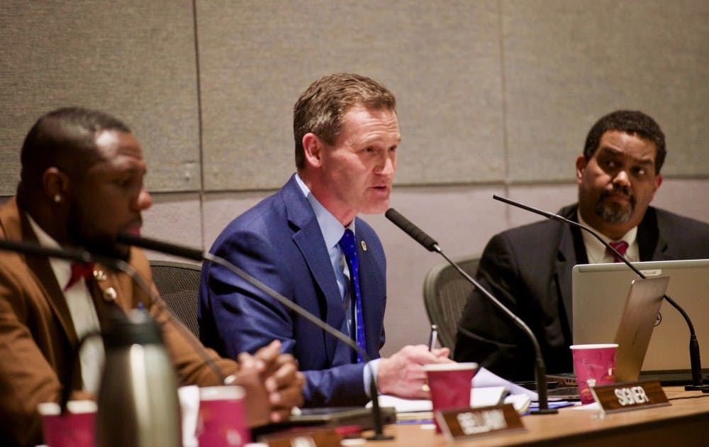<p>City Councilors Wes Bellamy (left) and Mike Signer (center), and City Manager Maurice Jones (right) at Tuesday night's meeting.&nbsp;</p>