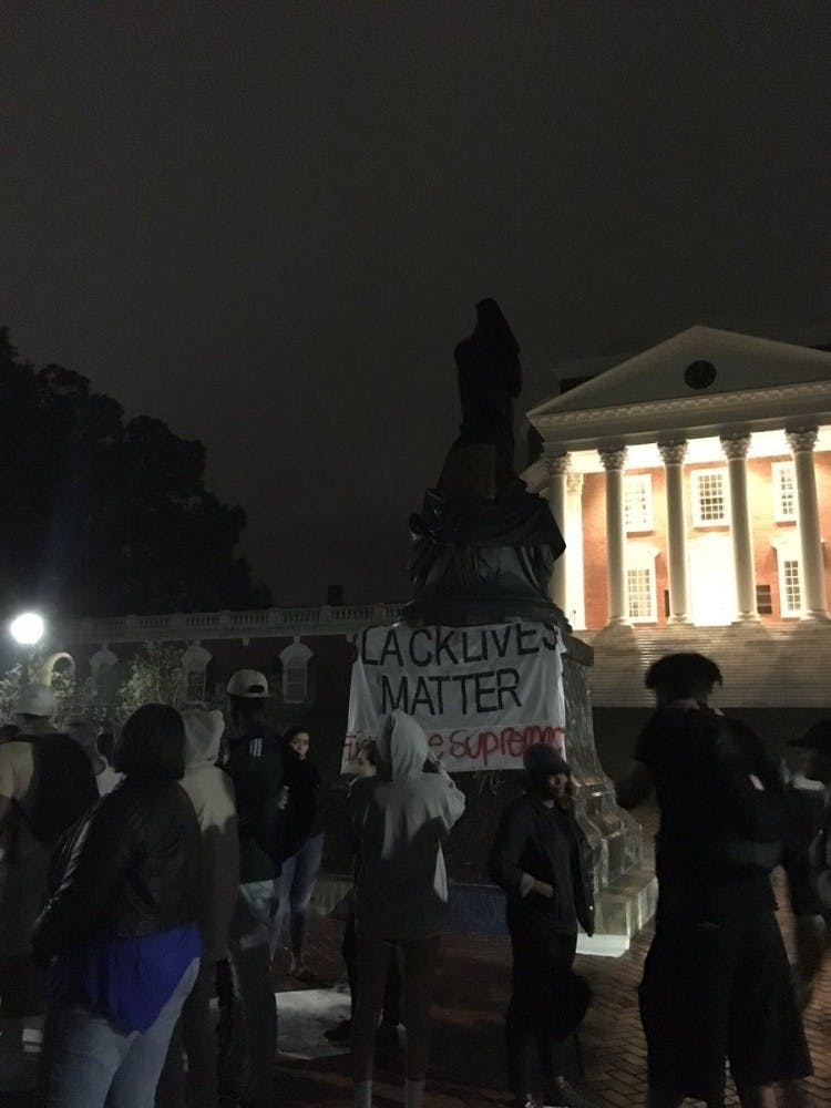 U.Va. student protesters covered the Thomas Jefferson statue in front of the Rotunda Tuesday night.&nbsp;