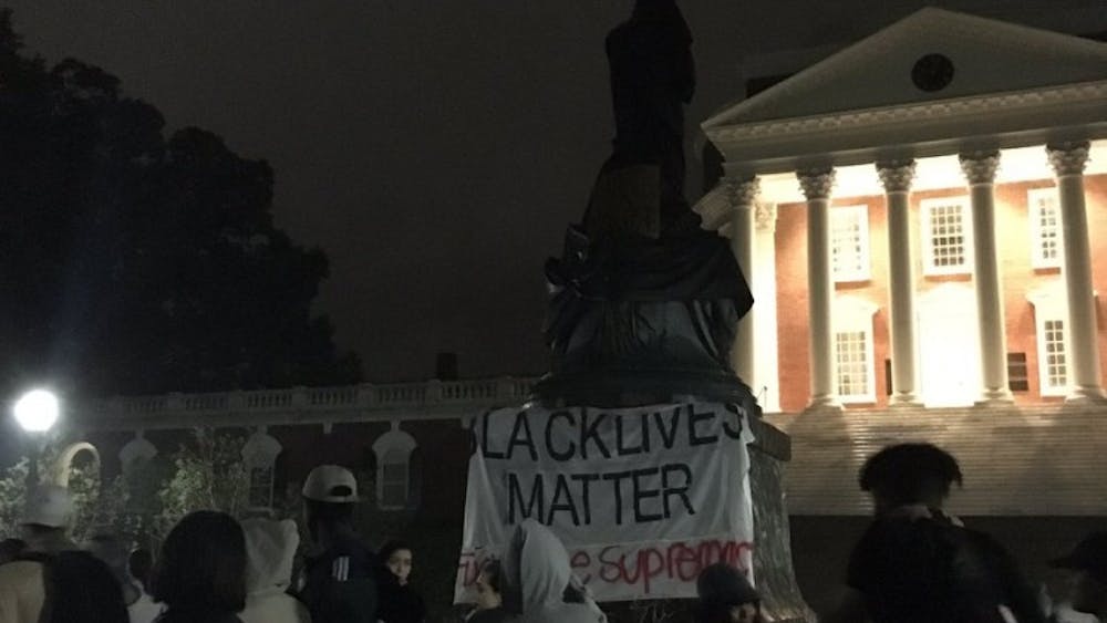 U.Va. student protesters covered the Thomas Jefferson statue in front of the Rotunda Tuesday night.&nbsp;
