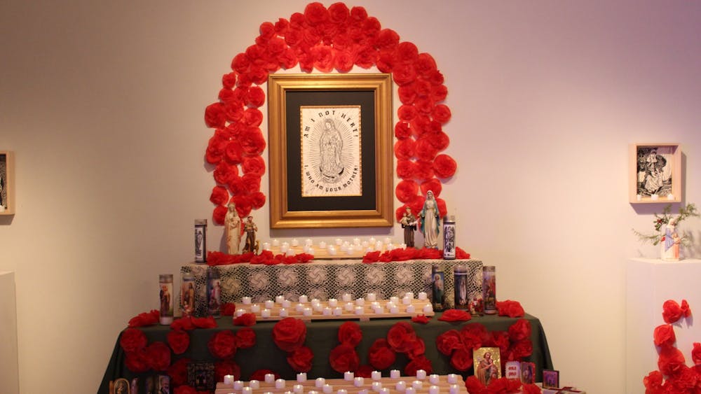 The focal point of the exhibit was a large altar along the left wall, under a piece entitled “Our Lady of Guadalupe.”