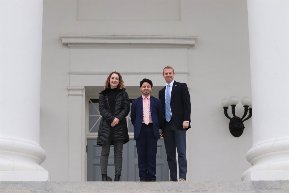 Student Council members Holli Foster, a second-year College student and vice chair of legislative affairs (left); Alex Cintron, a fourth-year College student and Student Council president (center); and Isaac Weintz, a third-year College student and chair of Student Council’s legislative affairs committee (right), pose for a picture on the steps of the Capitol building in Richmond.&nbsp;