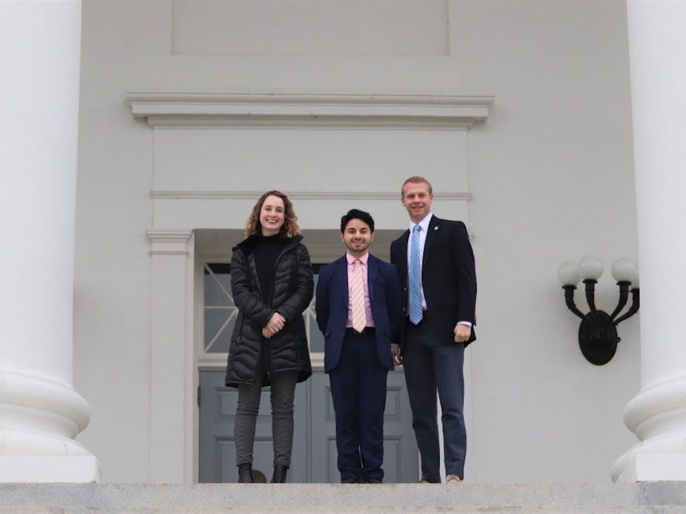 Student Council members Holli Foster, a second-year College student and vice chair of legislative affairs (left); Alex Cintron, a fourth-year College student and Student Council president (center); and Isaac Weintz, a third-year College student and chair of Student Council’s legislative affairs committee (right), pose for a picture on the steps of the Capitol building in Richmond. 