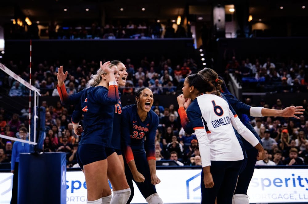 <p>The Cavaliers huddle up during their Oct. 6 match versus Miami in John Paul Jones Arena.</p>