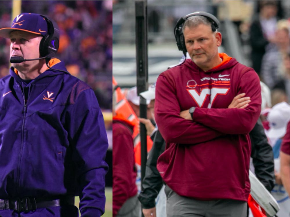 Virginia football Coach Bronco Mendenhall (left) and Virginia Tech football Coach Justin Fuente (right) have led their respective programs in different directions since both joining in 2015.
