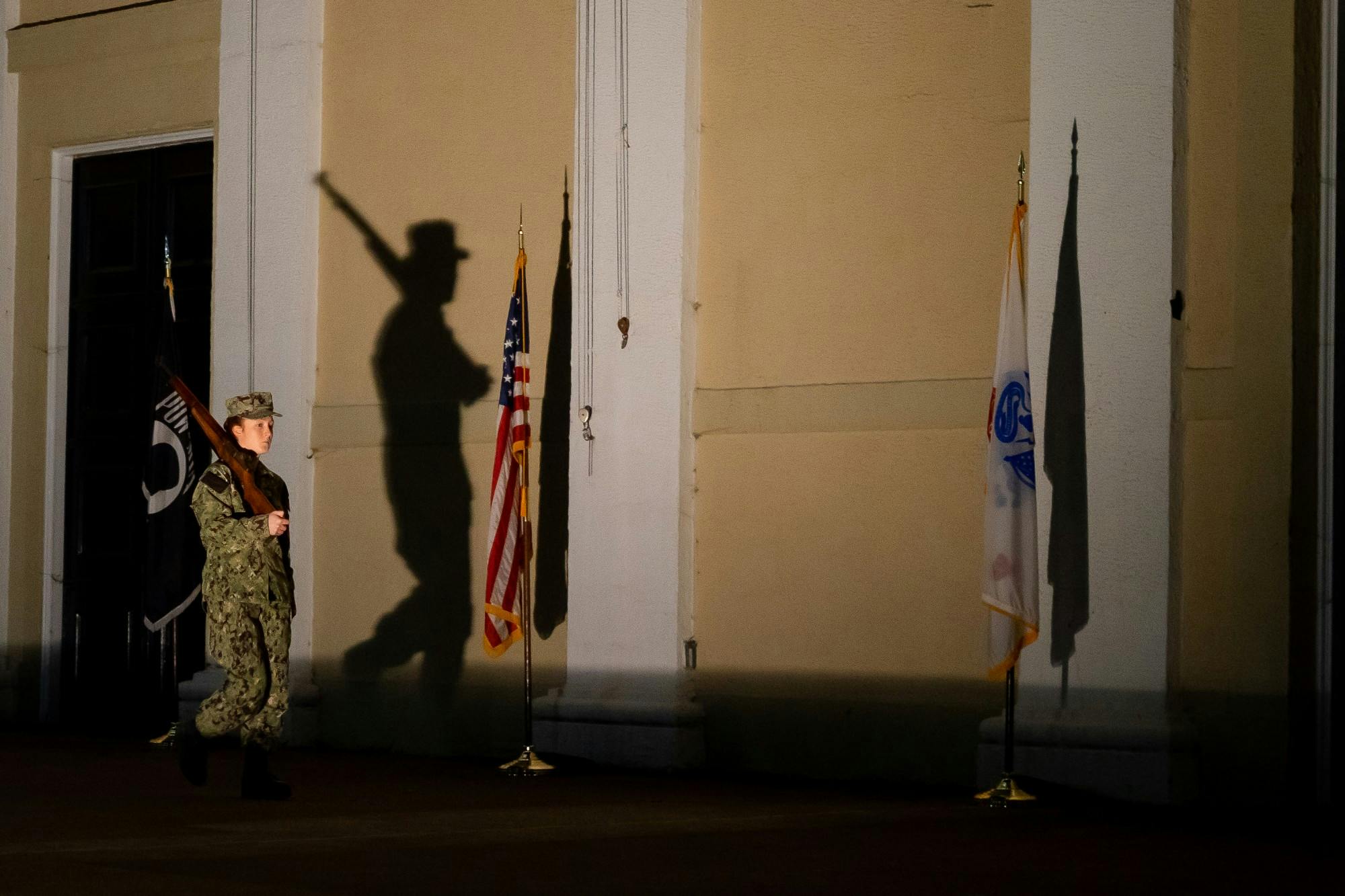 The amphitheatre was lit to cast the shadows of the cadets and raise awareness of the vigil Monday night.