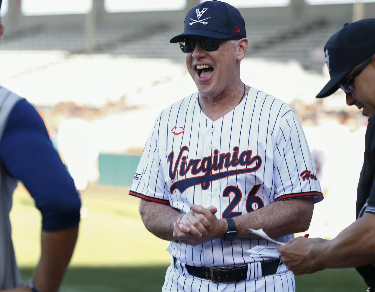 O'Connor chats with an opposing coach at a pregame lineup exchange.