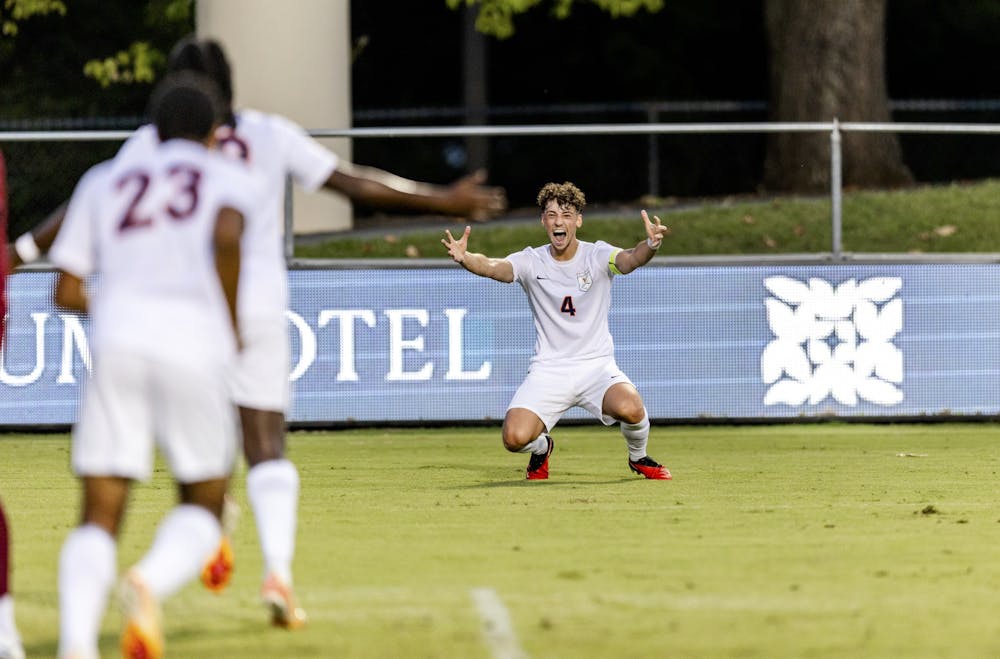 Paul Weise celebrates a Virginia goal.