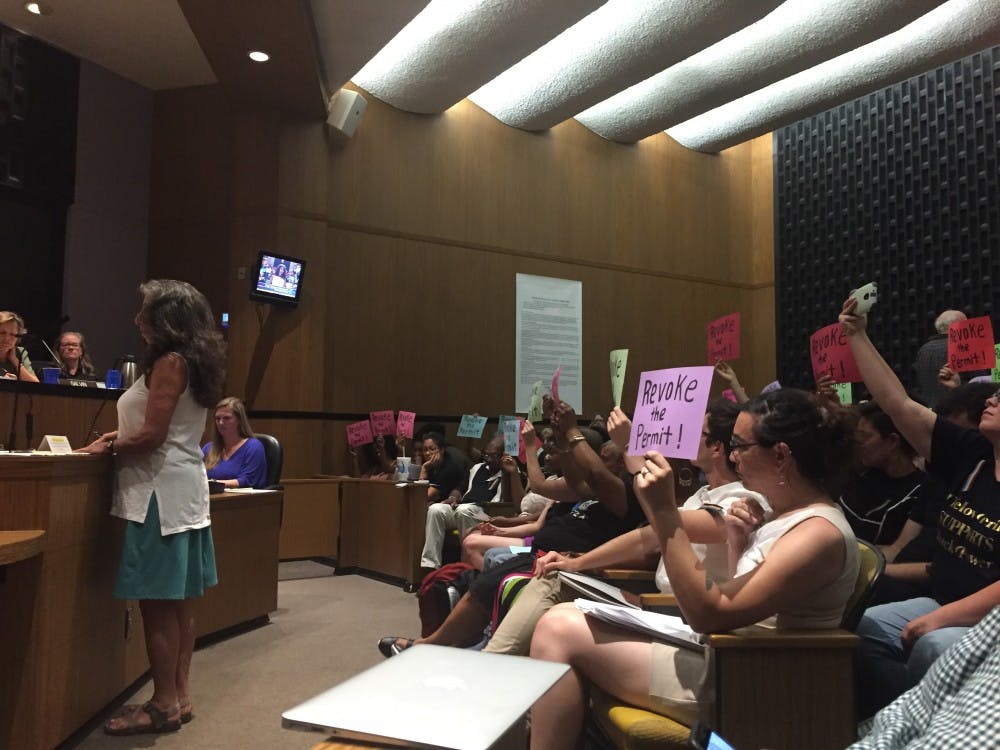 Many attendants were clad in Black Lives Matter shirts, and many held signs that read “Revoke the permit,” referring to their wish for the city to revoke the permit for the Aug. 12 rally.