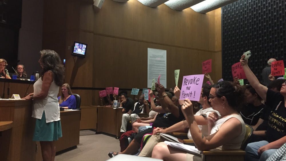 Many attendants were clad in Black Lives Matter shirts, and many held signs that read “Revoke the permit,” referring to their wish for the city to revoke the permit for the Aug. 12 rally.