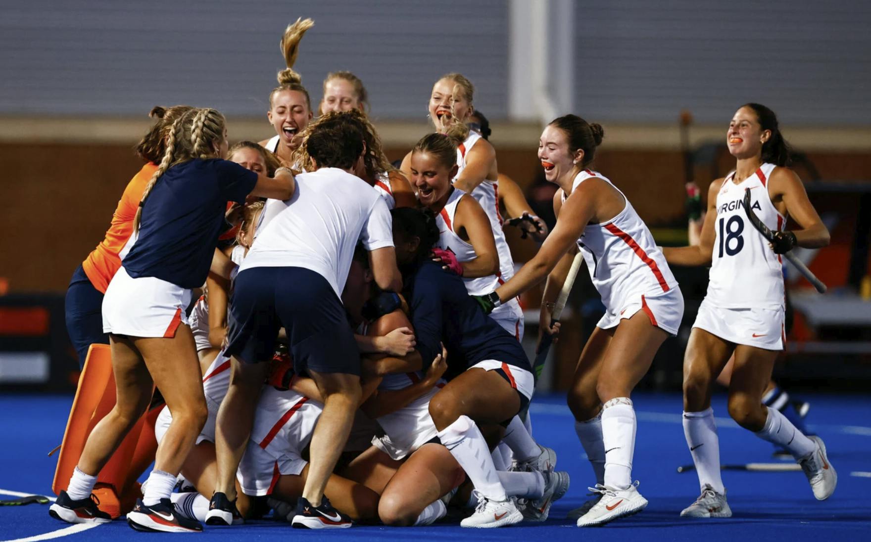 The Cavaliers mobbed around Emma Watchilla.