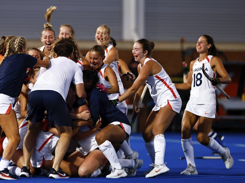 The Cavaliers mobbed around Emma Watchilla.