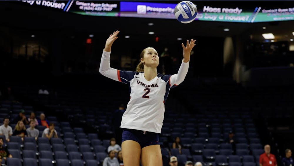 <p>Reagan Ennist winds up a serve during a match last week at John Paul Jones Arena.</p>