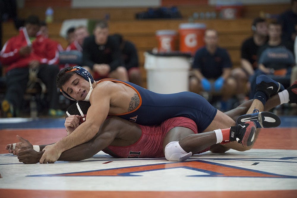 No. 13 senior Joe Spisak is back in action for Virginia, but the Cavaliers did not really push the Hawkeyes, who won eight of 10 matches at Carver-Hawkeye Arena. 