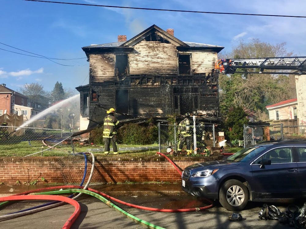 Crews working to extinguish the fire at the home on Anderson Street Saturday afternoon.&nbsp;