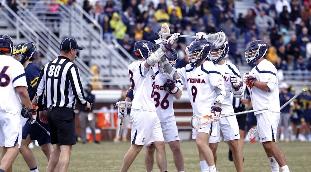 A group of Cavaliers celebrates after scoring one of their 19 goals.