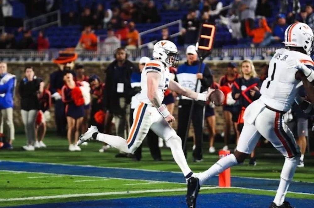 <p>Senior quarterback Brennan Armstrong sneaks into the end zone for a touchdown, one of the few bright spots of the night for the Virginia offense.</p>