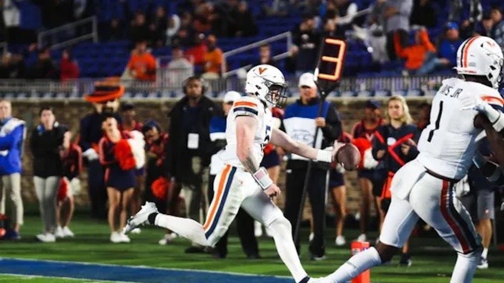 Senior quarterback Brennan Armstrong sneaks into the end zone for a touchdown, one of the few bright spots of the night for the Virginia offense.