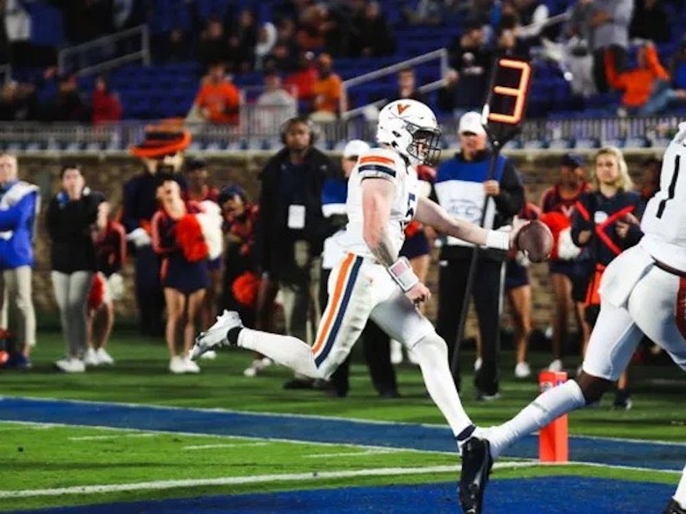 Senior quarterback Brennan Armstrong sneaks into the end zone for a touchdown, one of the few bright spots of the night for the Virginia offense.