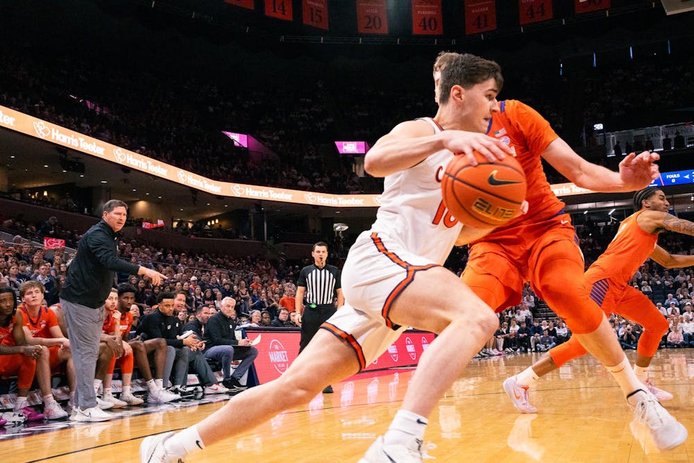 Senior Taine Murray drives past a Clemson defender.