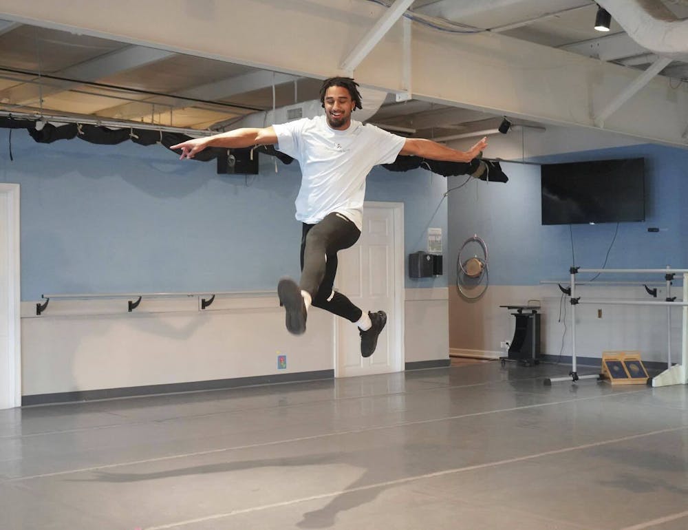 <p>Senior safety Jonas Sanker leaps through the air at the Charlottesville Ballet.</p>