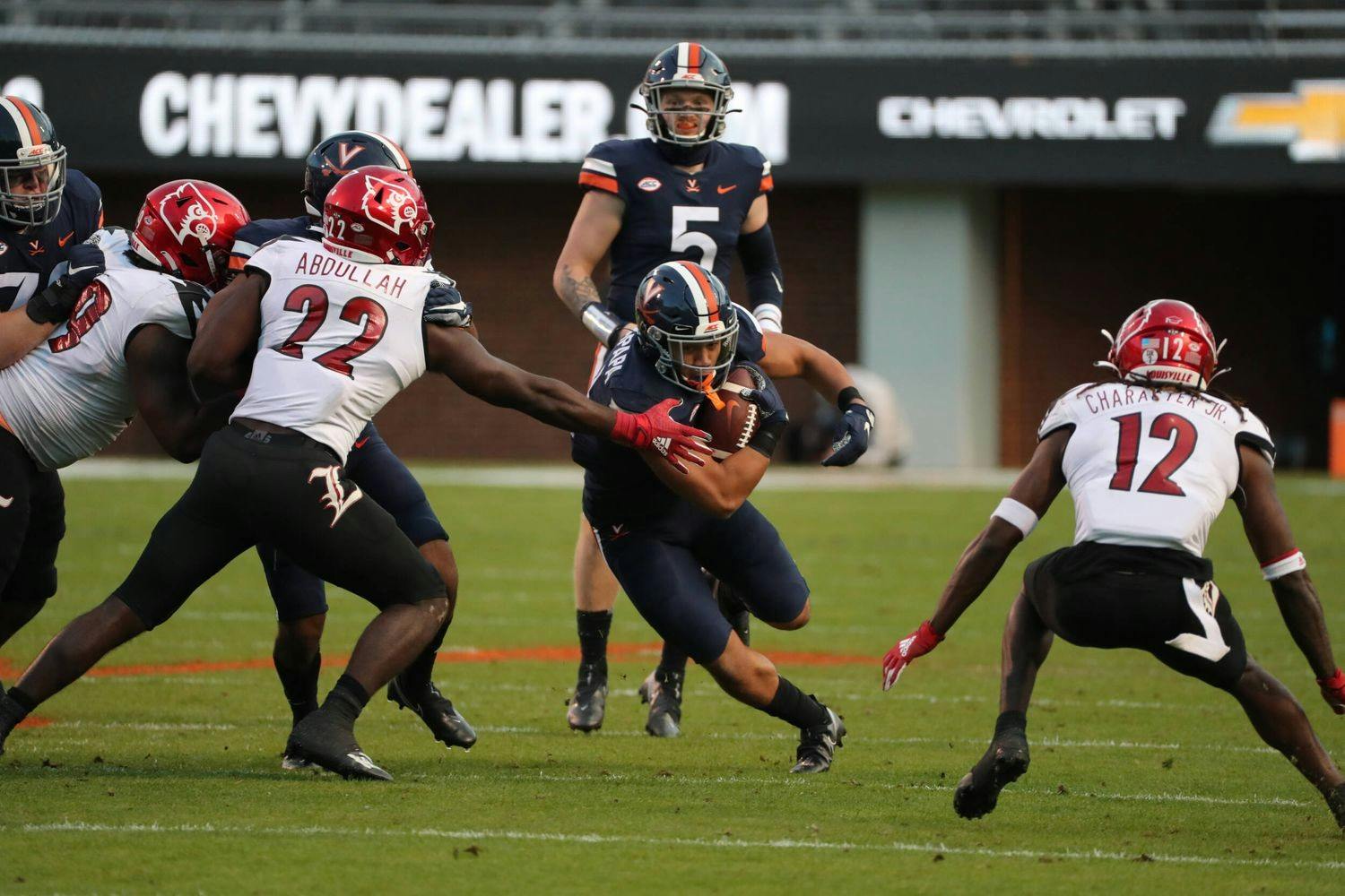 Senior running back Wayne Taulapapa and the Cavaliers will look to knock off a Louisville team that has had its fair share of nailbiters this season.