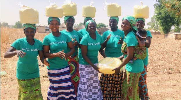 Ghanian women in the village of Woricambo come together to create shea butter from the nuts of the karite tree indigenous to Africa.&nbsp;