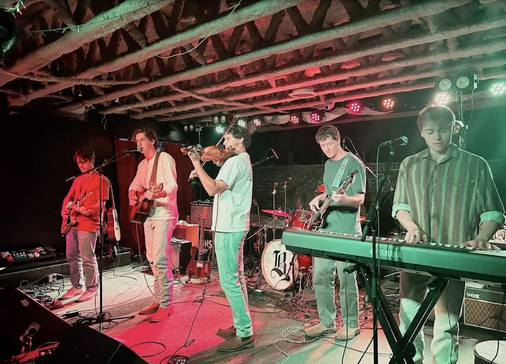 <p>Boscobel and Looseleaf watching the show’s encore from the audience amidst their friends demonstrated that above all, Thursday night’s show was a coming together of the Charlottesville music community.&nbsp;</p>