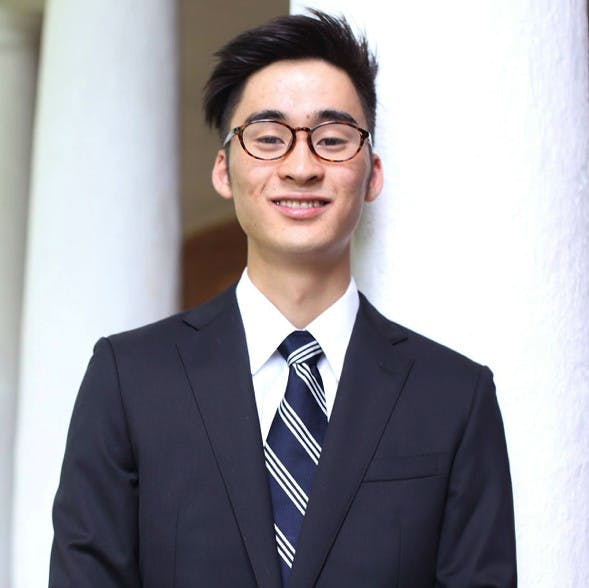 ShotaYear: FourthMajor: Biomedical EngineeringUVA Involvement: Club Tennis, Ceramics Club, University Guides, Fourth-Year TrusteesHometown: Osaka, JapanIdeal date personality: Someone who listens as well as they speak, who can explain things without simplifying. Someone who has mastered the Taoist art of how to be active without frenzy and how to get things done without pushing. These are deep virtues.Ideal date activity: I would love to wake up early on a crisp Saturday morning and head downtown to the Farmer’s Market &mdash; while of course nursing a slight hangover. There, I’d look at the locally crafted pottery and subtly share that I also make pottery. We’d grab some seasonal breakfast and walk around &mdash; there’s a lot to see! If the conversation is not awkward, I’d love to hang out on the Lawn afterwards and get to know her better.Dealbreakers?: Talks non-stop or never talks. Not fashion-inclusive.Describe a typical weekend: Playing tennis, sleeping 10 hours a day, wasting a lot of time on social media.Hobbies: Tennis, pottery, Settlers of Catan, volleyball, ping pongWhat makes you a good catch?: I have a variety of talentsWhat makes you a less-than-perfect catch?: My room is perpetually messy.What is your spirit animal?: RabbitWhat is your favorite pick-up line?: Are you a piece of trash? Because I really want to take you out.Describe yourself in one sentence: To be unavailable to our friends and family, to be unable to find time for the sunset, to whiz through our obligations without time for a single mindful breath &mdash; this has become the model of a successful life.