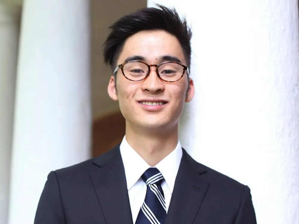 ShotaYear: FourthMajor: Biomedical EngineeringUVA Involvement: Club Tennis, Ceramics Club, University Guides, Fourth-Year TrusteesHometown: Osaka, JapanIdeal date personality: Someone who listens as well as they speak, who can explain things without simplifying. Someone who has mastered the Taoist art of how to be active without frenzy and how to get things done without pushing. These are deep virtues.Ideal date activity: I would love to wake up early on a crisp Saturday morning and head downtown to the Farmer’s Market — while of course nursing a slight hangover. There, I’d look at the locally crafted pottery and subtly share that I also make pottery. We’d grab some seasonal breakfast and walk around — there’s a lot to see! If the conversation is not awkward, I’d love to hang out on the Lawn afterwards and get to know her better.Dealbreakers?: Talks non-stop or never talks. Not fashion-inclusive.Describe a typical weekend: Playing tennis, sleeping 10 hours a day, wasting a lot of time on social media.Hobbies: Tennis, pottery, Settlers of Catan, volleyball, ping pongWhat makes you a good catch?: I have a variety of talentsWhat makes you a less-than-perfect catch?: My room is perpetually messy.What is your spirit animal?: RabbitWhat is your favorite pick-up line?: Are you a piece of trash? Because I really want to take you out.Describe yourself in one sentence: To be unavailable to our friends and family, to be unable to find time for the sunset, to whiz through our obligations without time for a single mindful breath — this has become the model of a successful life.