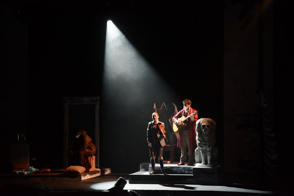 <p>Drama graduate student Christian O'Neill as King Leo stands with the ghost of his dead son, played by first-year College student Katherine Haines, getting his feelings out through song.&nbsp;</p>