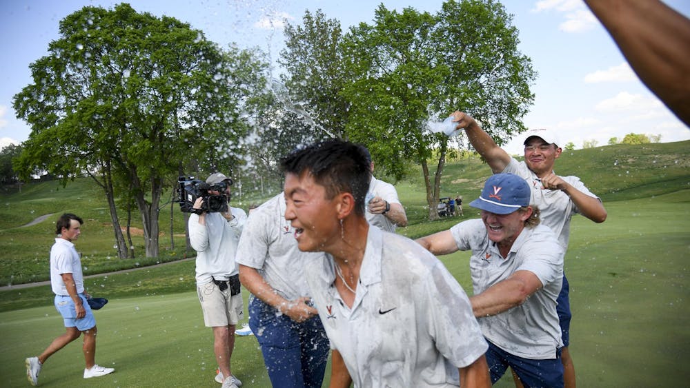 Bryan Lee and his teammates celebrate on the final hole after winning the ACC Championships.