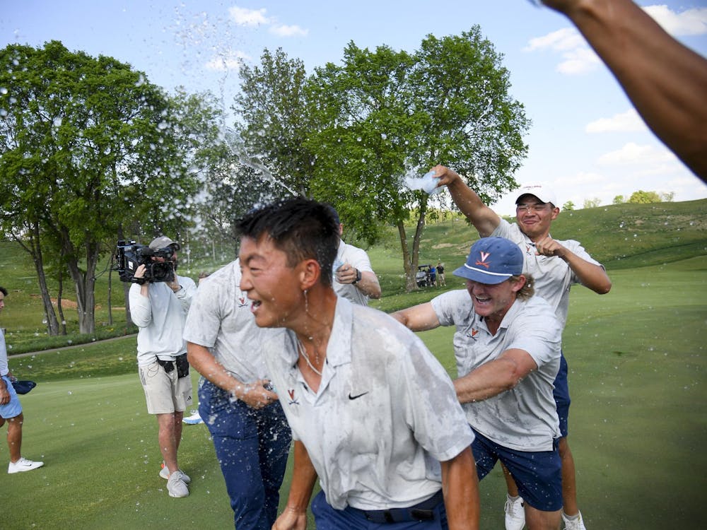 Bryan Lee and his teammates celebrate on the final hole after winning the ACC Championships.