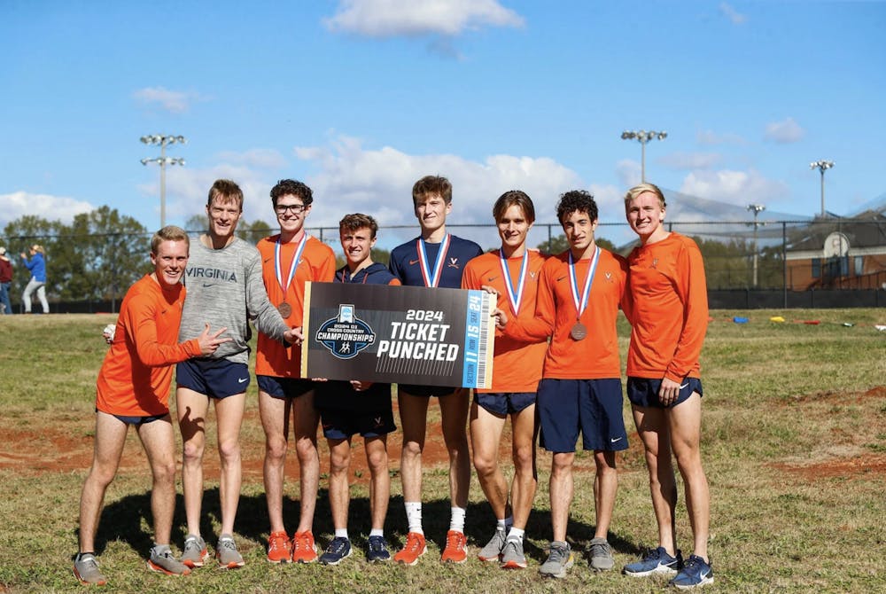 <p>Virginia runners celebrate their win at the NCAA Southeast Regional last week.</p>