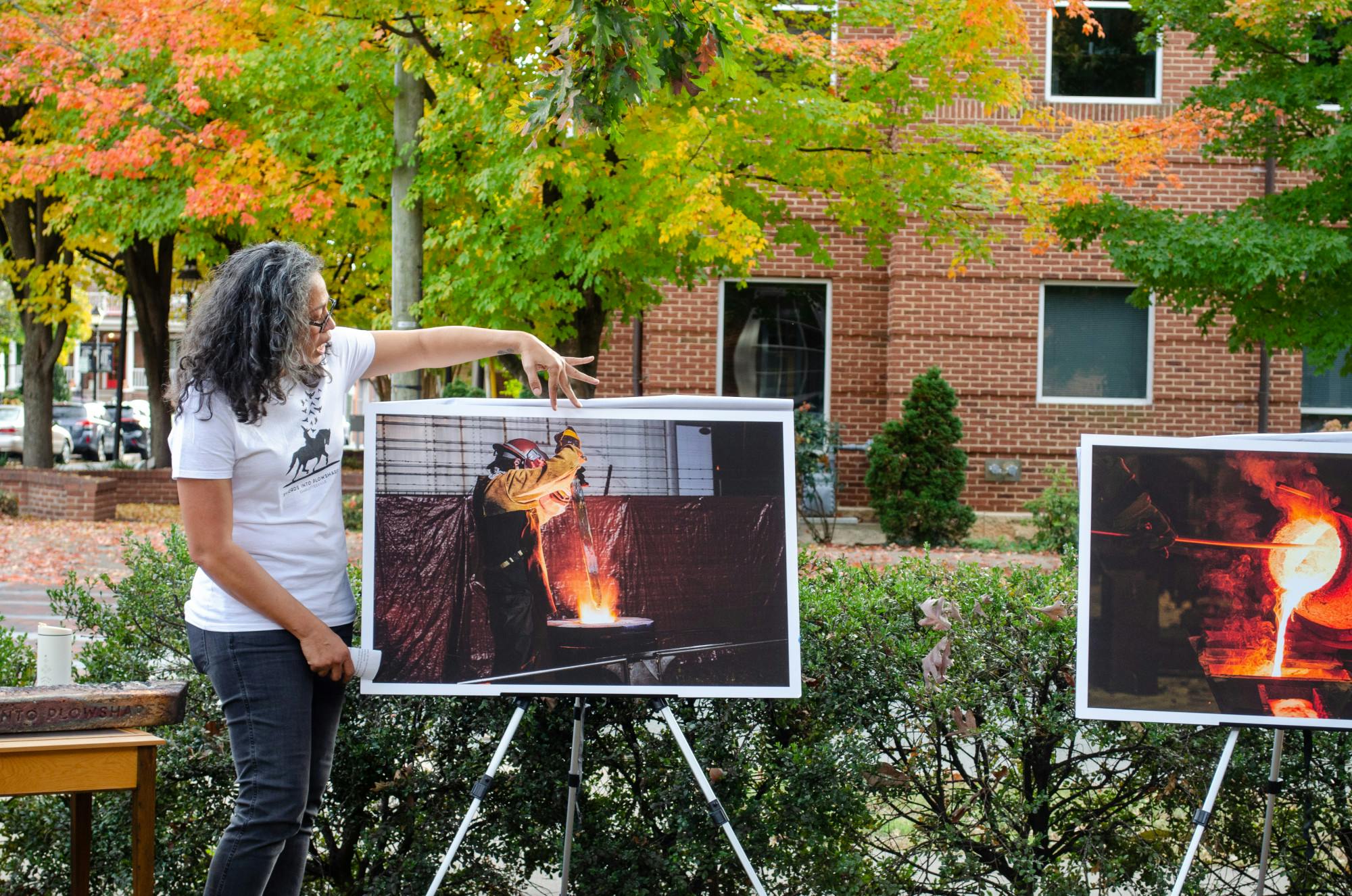 Event organizers unveiled blown up images from the melting process. One depicted the Confederate’s sword being thrust into the furnace.