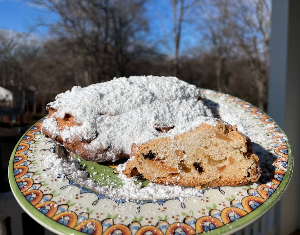 Pronounced “sh-toll-uhn,” stollen is a fruit and nut bread that is baked in a log-shape and coated in powdered sugar.