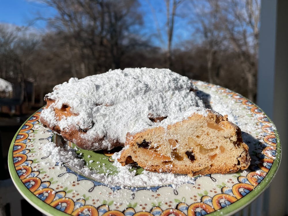 Pronounced “sh-toll-uhn,” stollen is a fruit and nut bread that is baked in a log-shape and coated in powdered sugar.