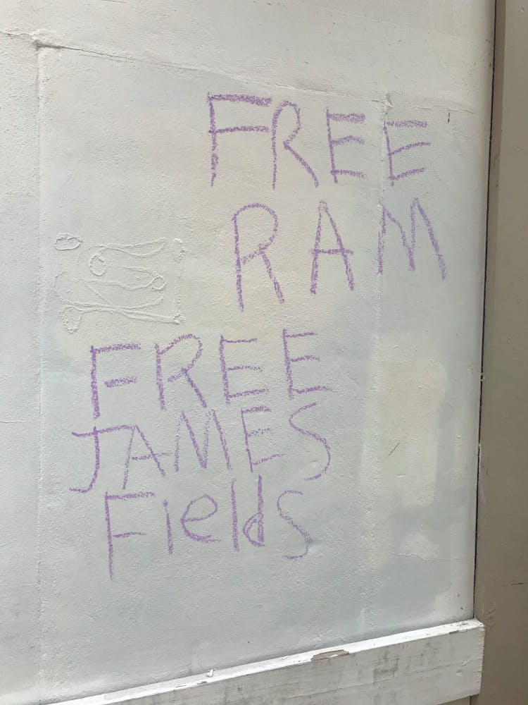 As of Monday evening, the flyers around Heather Heyer Way had been destroyed and replaced with anti-fascist stickers.