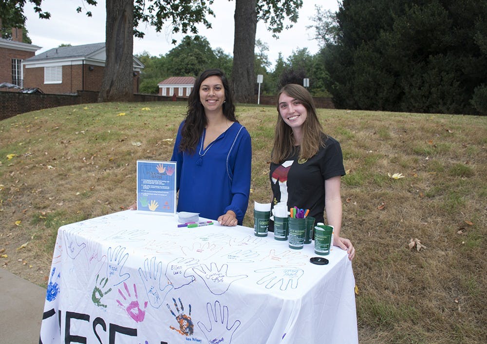 <p>Volunteers manned tables on the lawn all week&nbsp;for students to sign the pledge and trace their hands on a banner.&nbsp;</p>