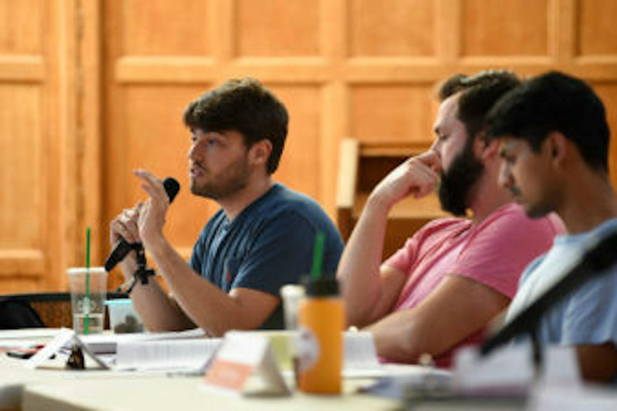 Ian Wallace '20 (left), LGBTQ+ liaison at-large and current chair of the S.A. infrastructure fund commission, advocates for creating the position of the vice president of infrastructure.
