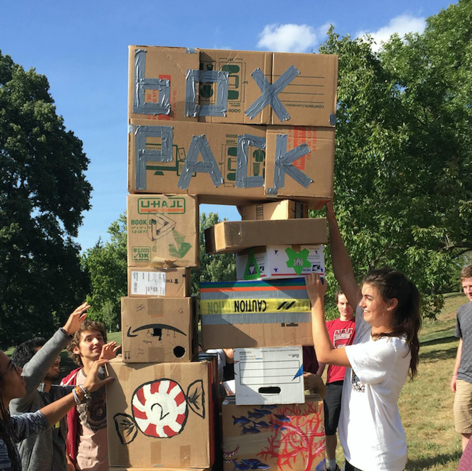 Students build a box fort on Libe Slope.