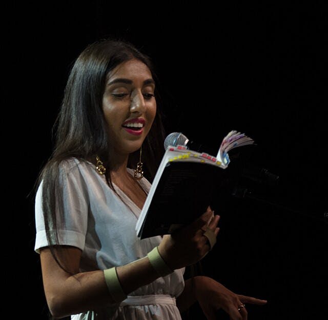 Rupi_Kaur_reading_from_her_book_milk_and_honey_in_Vancouver_-_2017