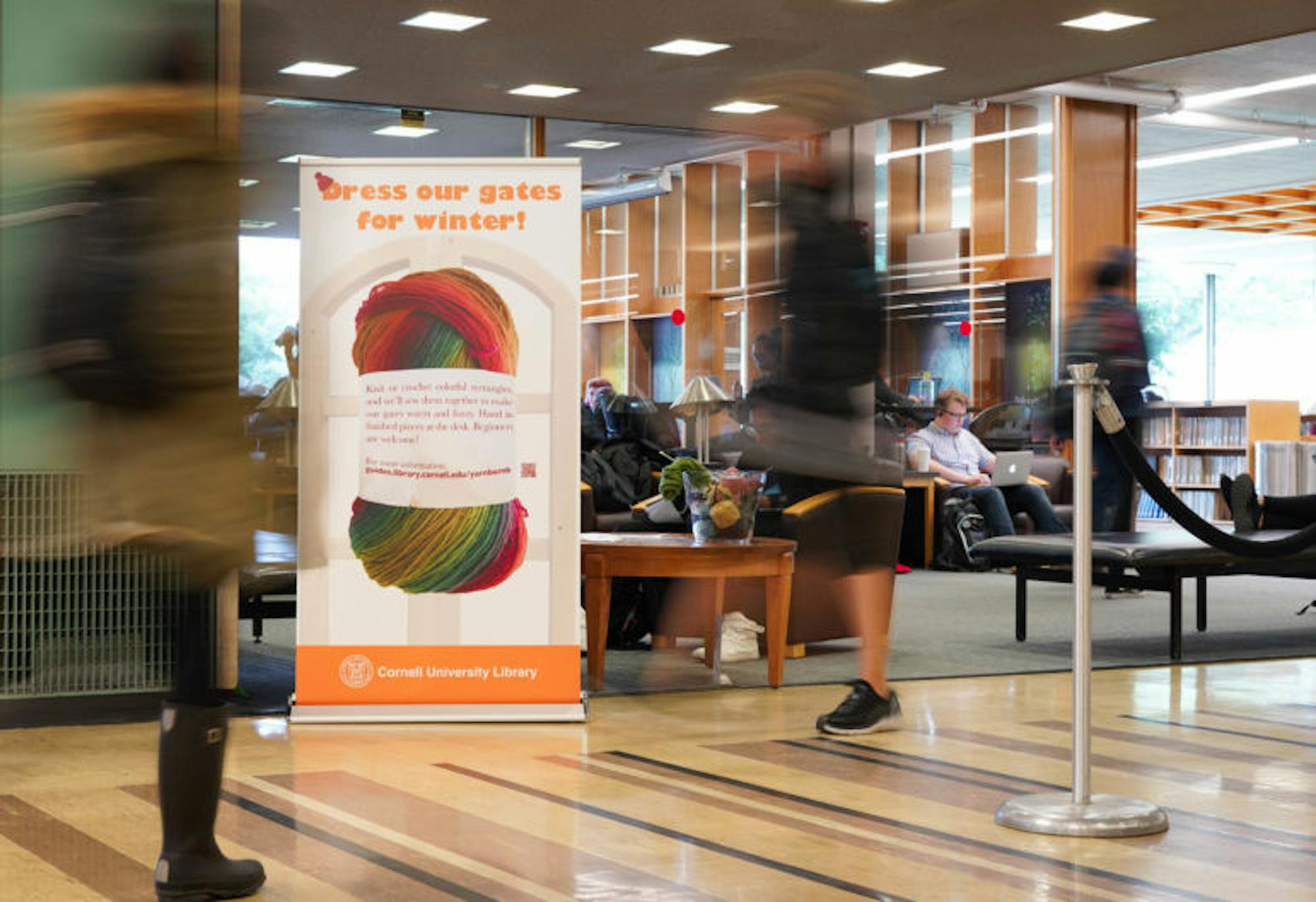 As winter approaches, students at Olin, Mann, Math and Vet Libraries now have the opportunity to crochet or knit covers for the library security gates as a way to destress. (Jing Jiang / Sun Staff Photographer)