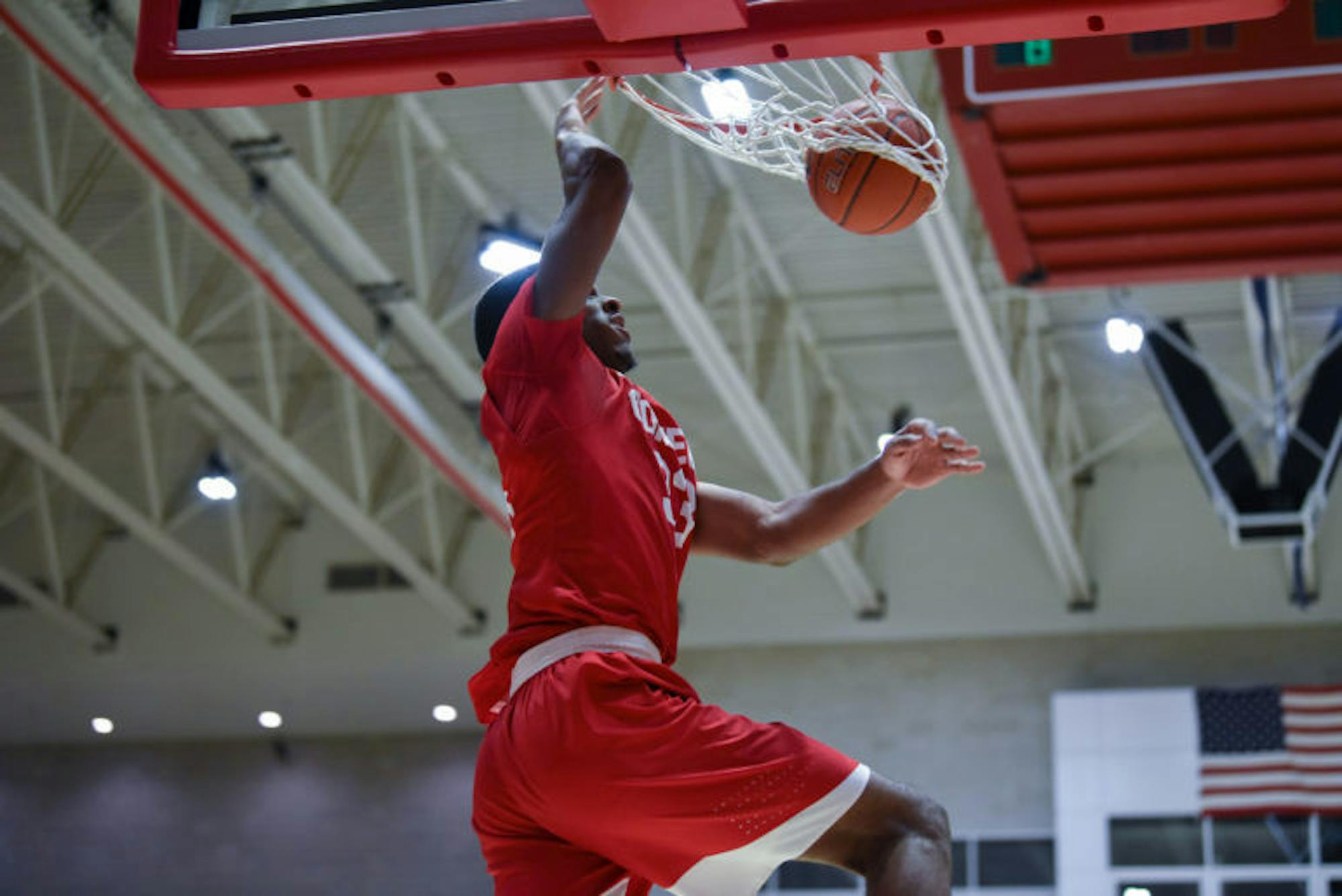 Senior forward Steven Julian dunks the ball at the game against Princeton on Saturday. Despite a second-half comeback, the Red ultimately fell to the Tigers in overtime, 70-61. (Boris Tsang / Sun Assistant Photography Editor)